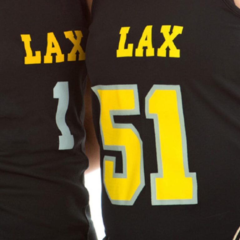 Smiling female la crosse players with sticks, studio isolated on